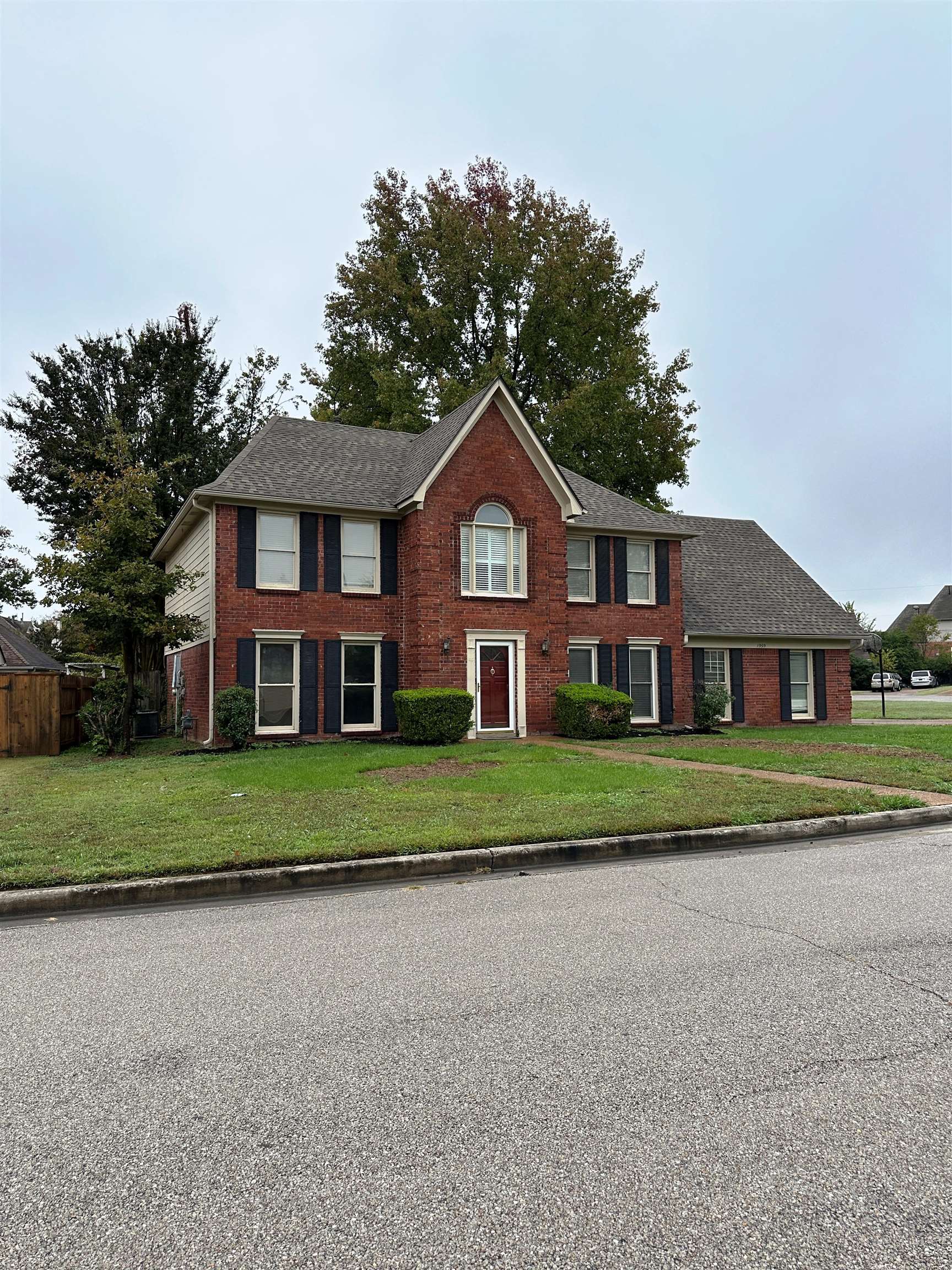 1959 Dartford Cove Memphis, TN 38016 - Photo 2 of 25 a front view of a house with a yard