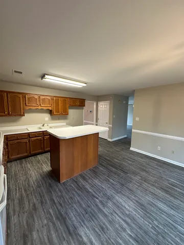 a large kitchen with a sink and dish washer