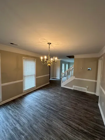 a view of a livingroom with wooden floor