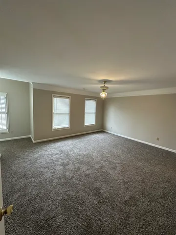 an empty room with a empty space and window