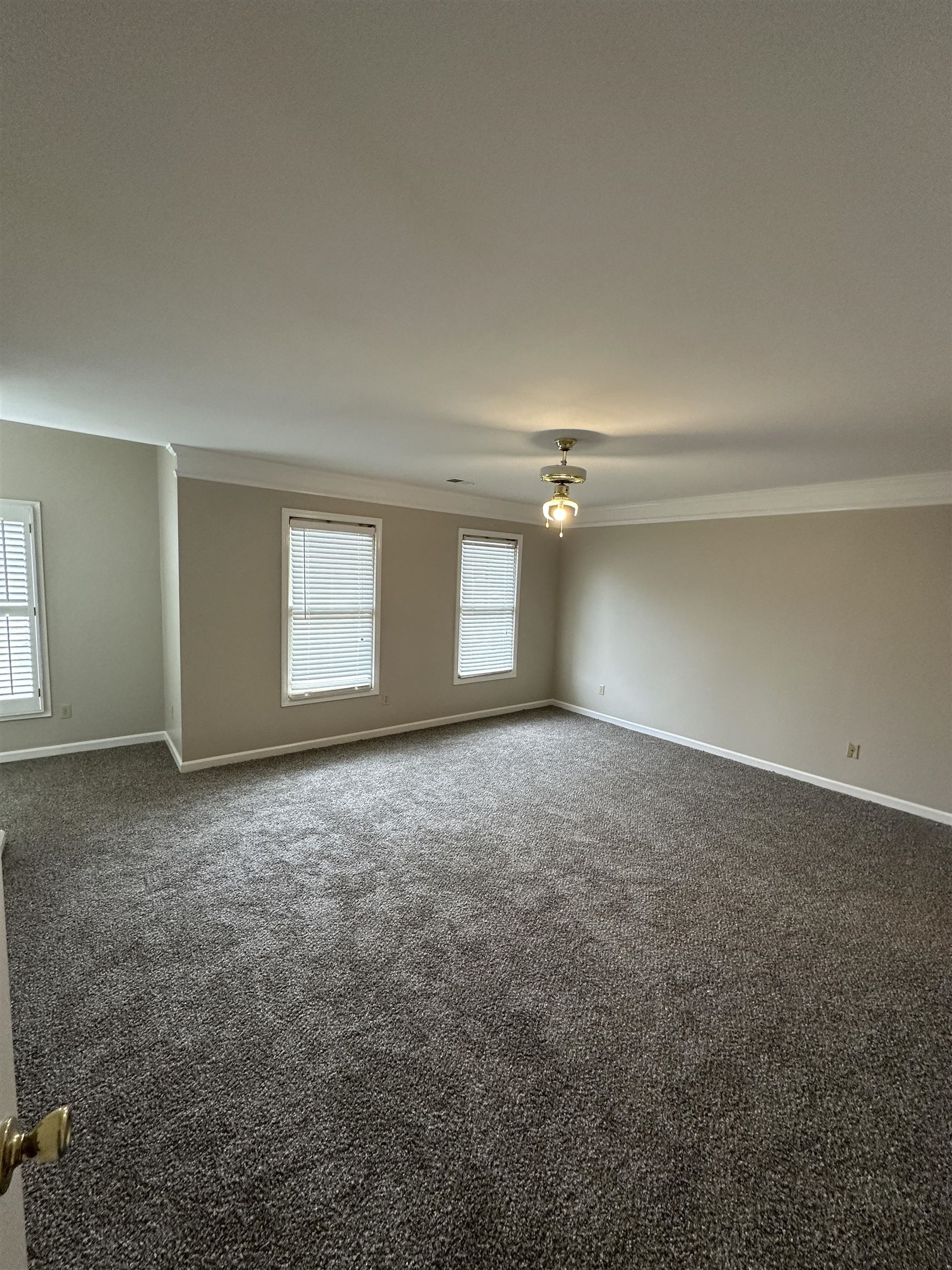 1959 Dartford Cove Memphis, TN 38016 - Photo 10 of 25 an empty room with a empty space and window