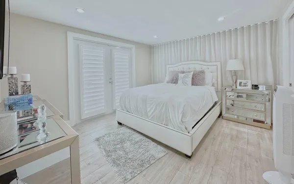 a bedroom with a bed and a view of bathroom