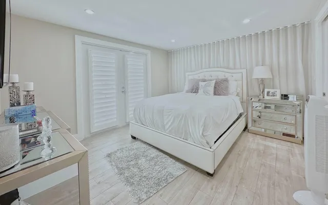 a bedroom with a bed and a view of bathroom