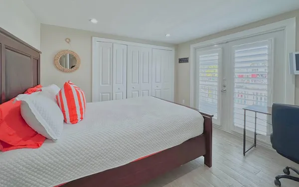 a bedroom with a bed and a dresser