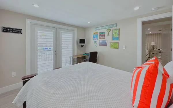 a bed room with a bed and a chair