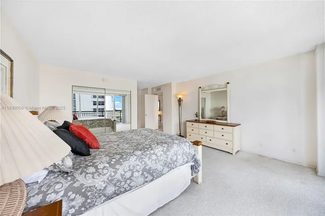 a bedroom with a bed and dresser