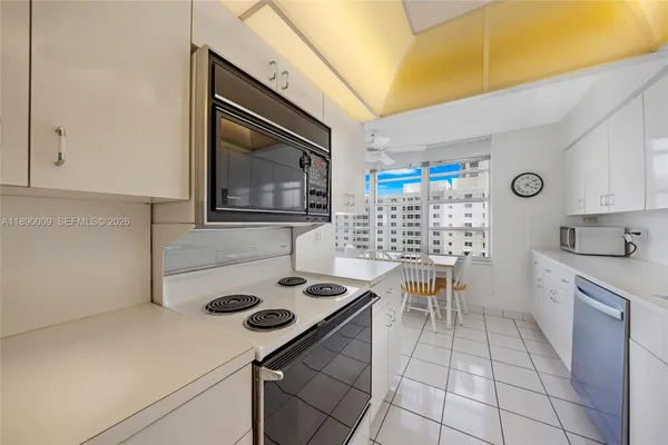 a kitchen with a stove and a refrigerator