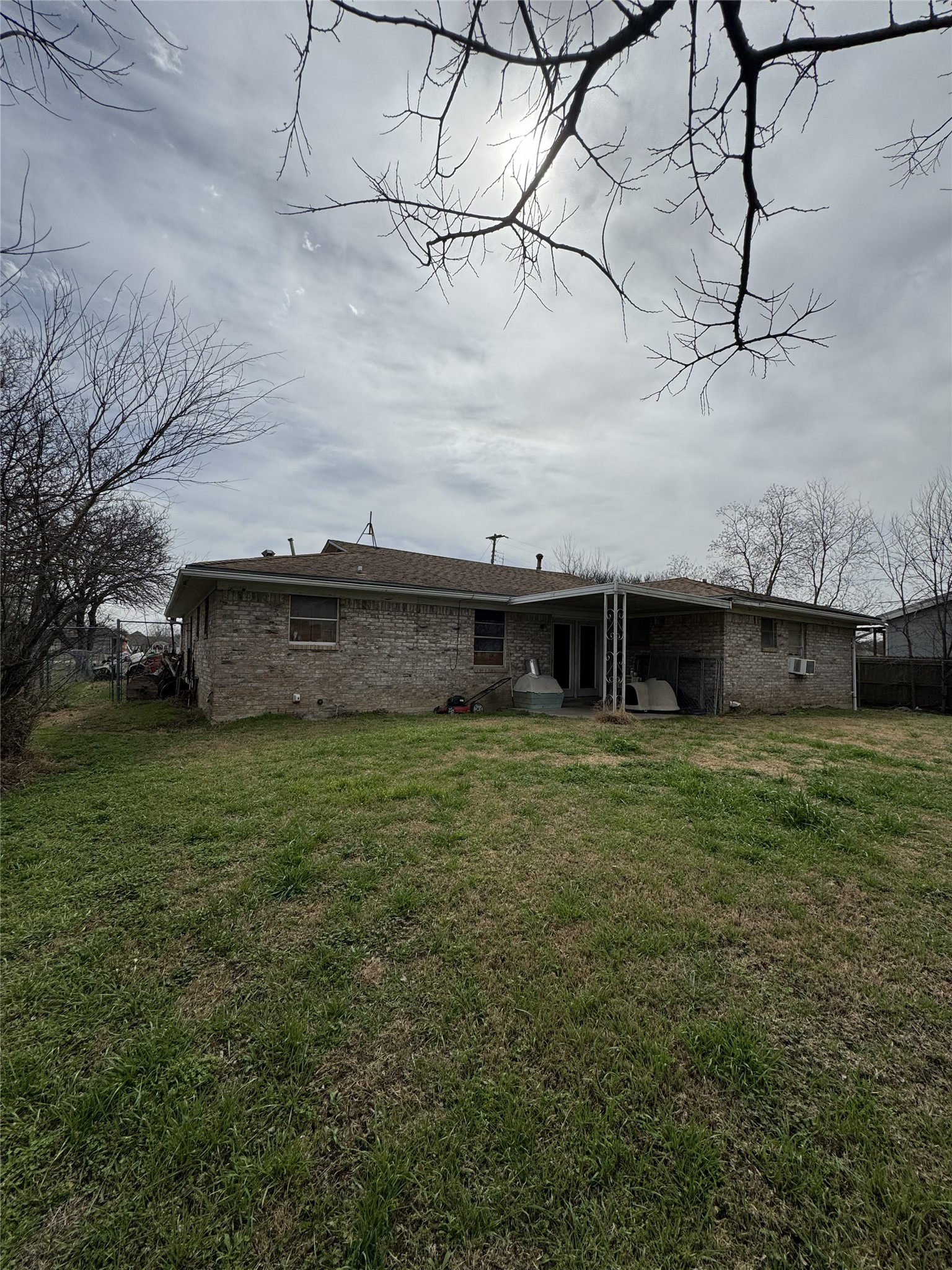 106 North 7th Street Dawson, TX 76639 - Photo 26 of 28 Rear view of house with a patio and brick siding
