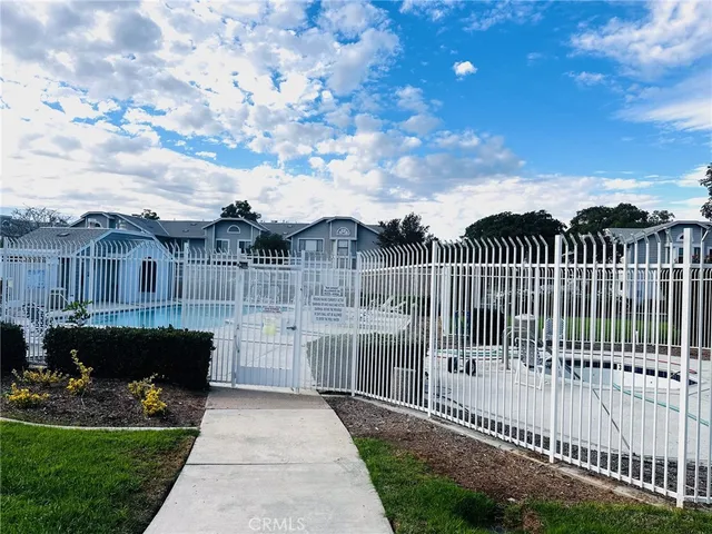 a view of a wrought iron fences in front of house