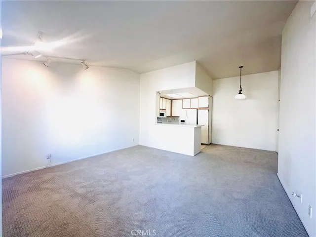 a view of a room with cabinet and a ceiling fan