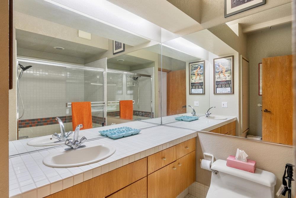 201 Shirley Cyn Road, Unit 233 Olympic Valley, CA 96146 - Photo 11 of 27 a bathroom with a granite countertop sink and a mirror