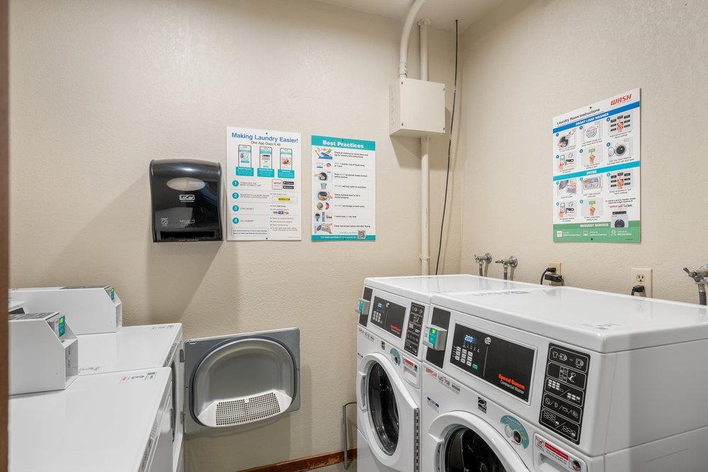 201 Shirley Cyn Road, Unit 233 Olympic Valley, CA 96146 - Photo 23 of 27 a utility room with dryer and washer