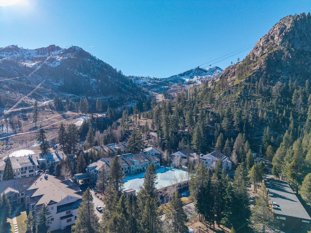 201 Shirley Cyn Road, Unit 233 Olympic Valley, CA 96146 - Photo 26 of 27 a view of a city with mountains in the background