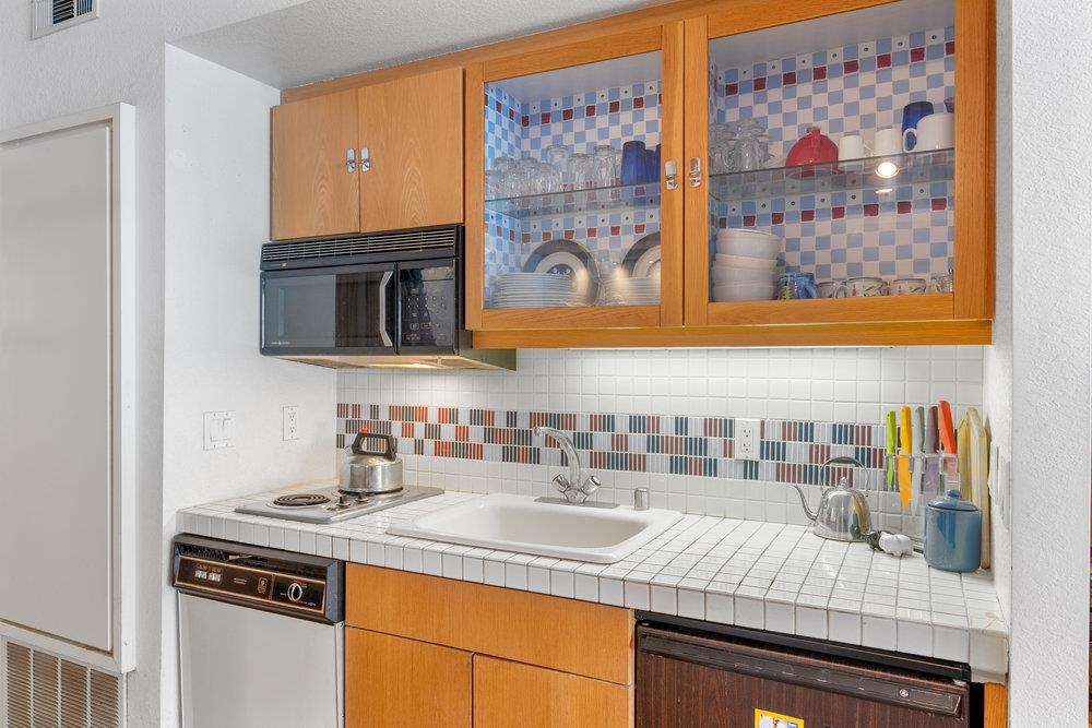 201 Shirley Cyn Road, Unit 233 Olympic Valley, CA 96146 - Photo 8 of 27 a view of a kitchen with a sink and a microwave