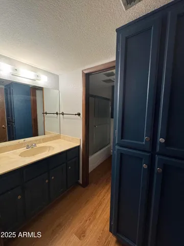 a bathroom with a double vanity sink and mirror