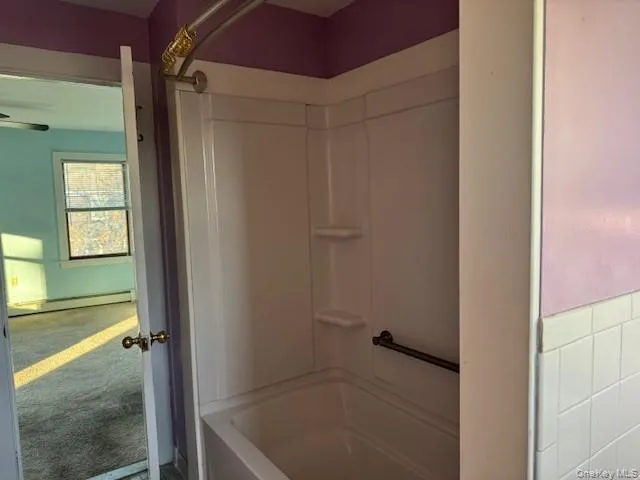 a bathroom with a sink mirror and toilet