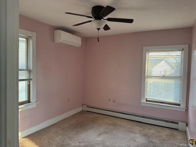 17 A Wheeler Avenue, Unit 17A Warwick, NY 10990 - Photo 9 of 18 an empty room with windows and fan