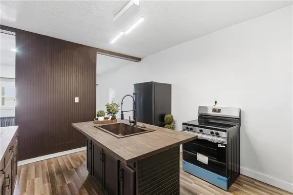 a kitchen with a sink and cabinets