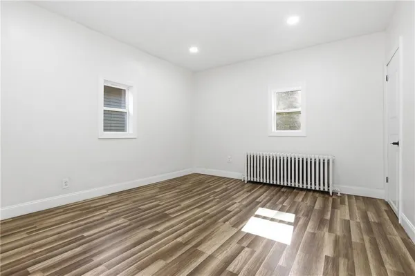 a bedroom with a bed and a chair