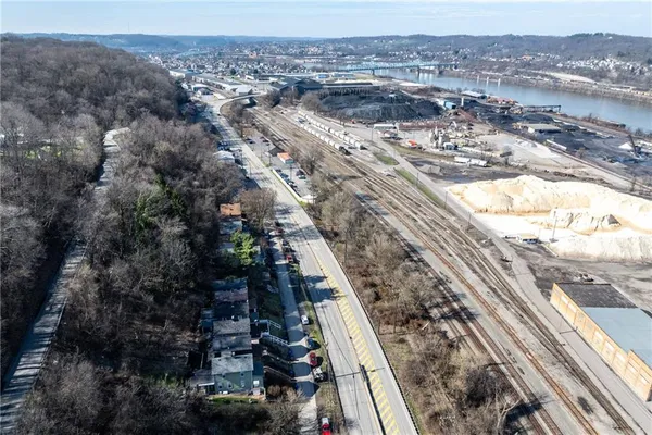 a view of a house with wooden floor and stairs