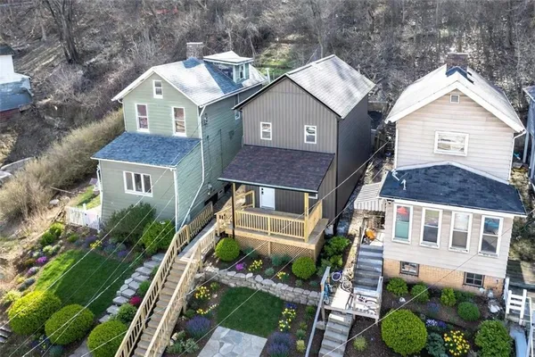 a aerial view of a house with a garden