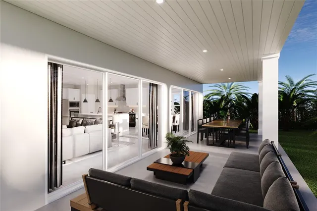 a kitchen with stainless steel appliances kitchen island granite countertop a stove a refrigerator a sink a dining table and chairs with wooden floor