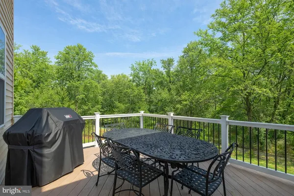 a view of balcony with furniture and wooden deck