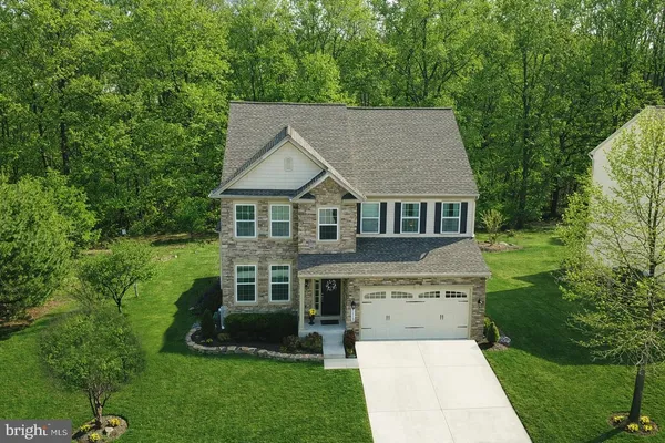 a aerial view of a house with a yard
