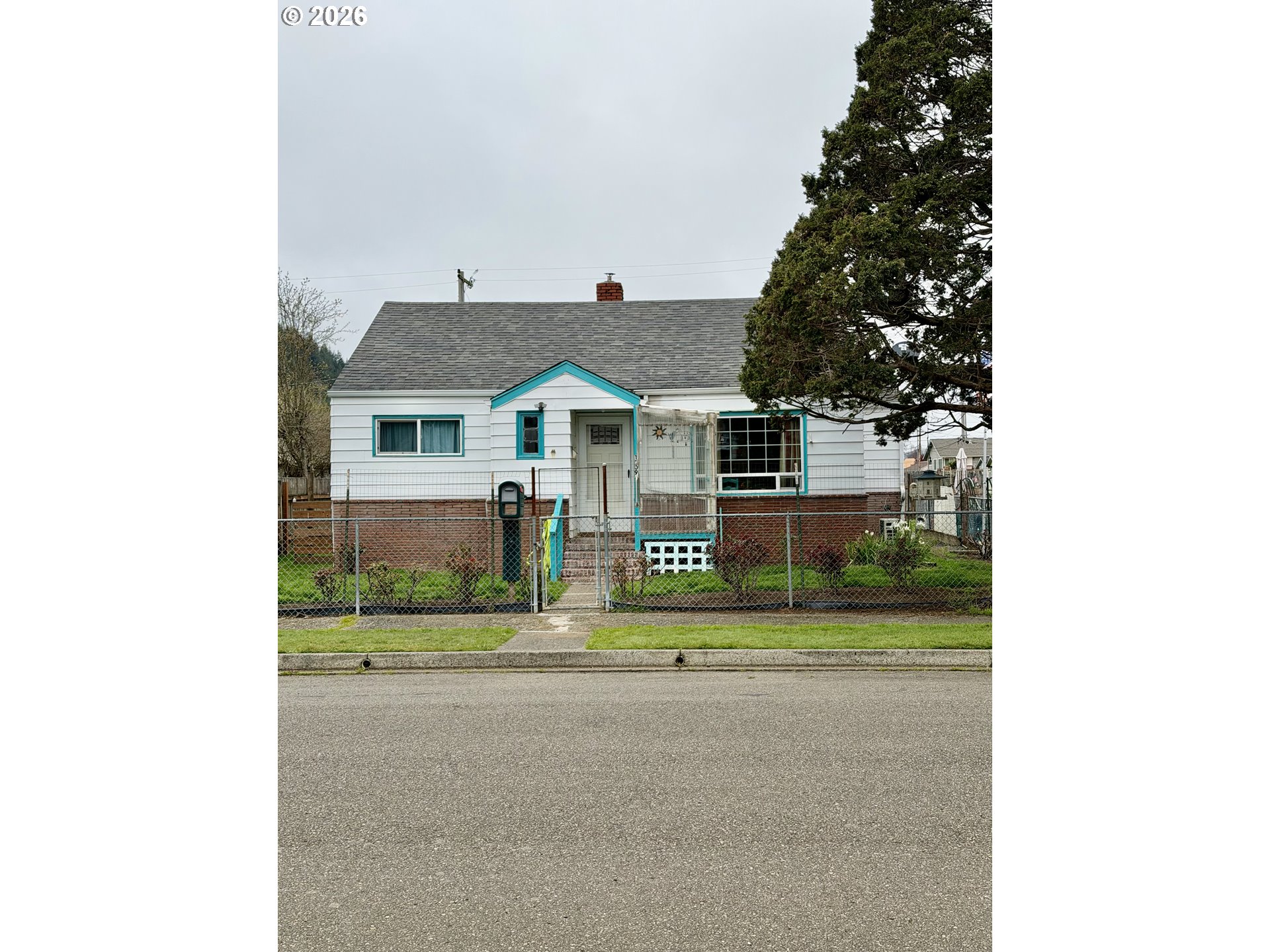 1009 Fir Avenue Reedsport, OR 97467 - Photo 1 of 16 a view of house with outdoor space and tall windows