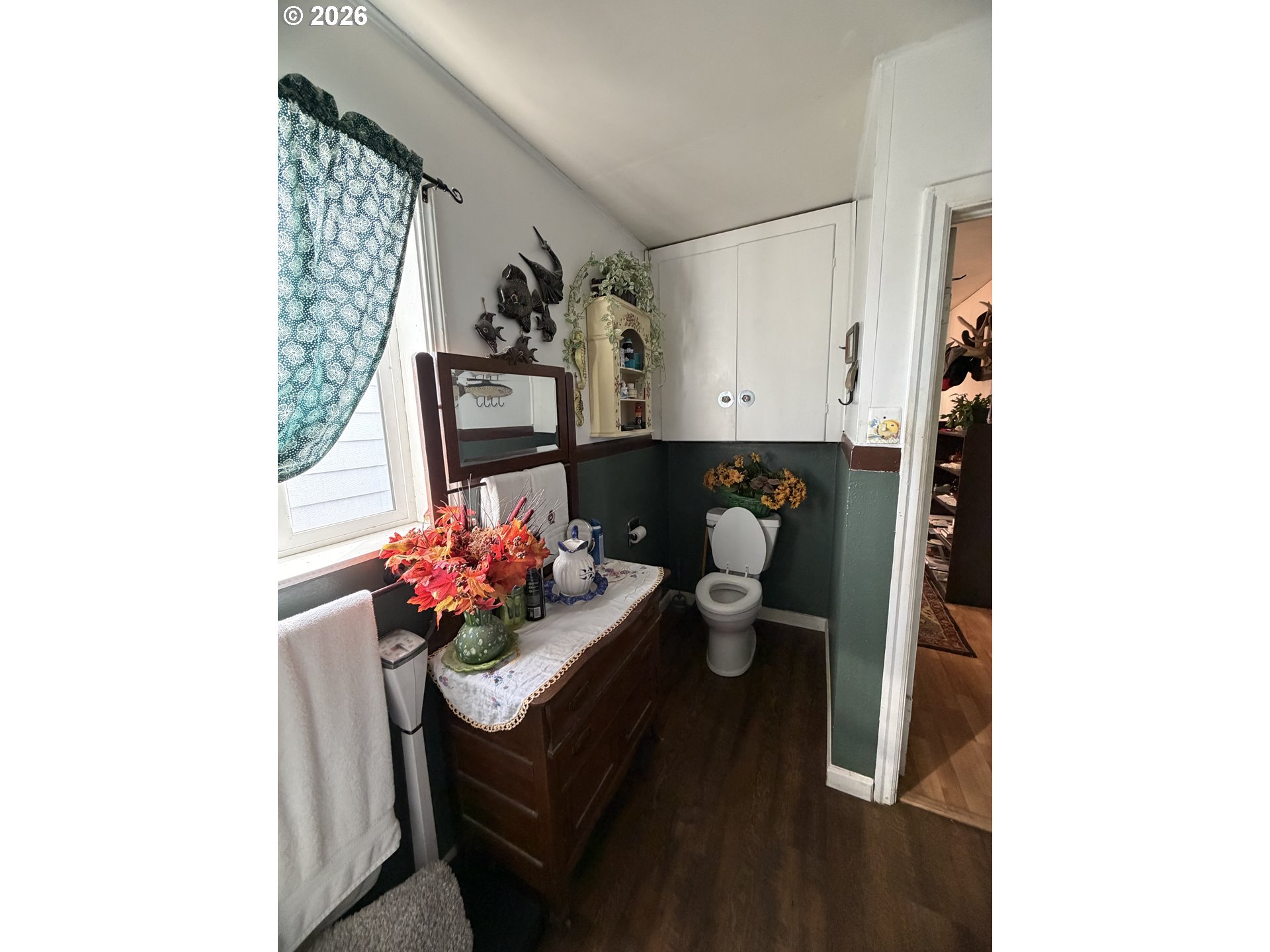 1009 Fir Avenue Reedsport, OR 97467 - Photo 13 of 16 a living room with furniture and flowers
