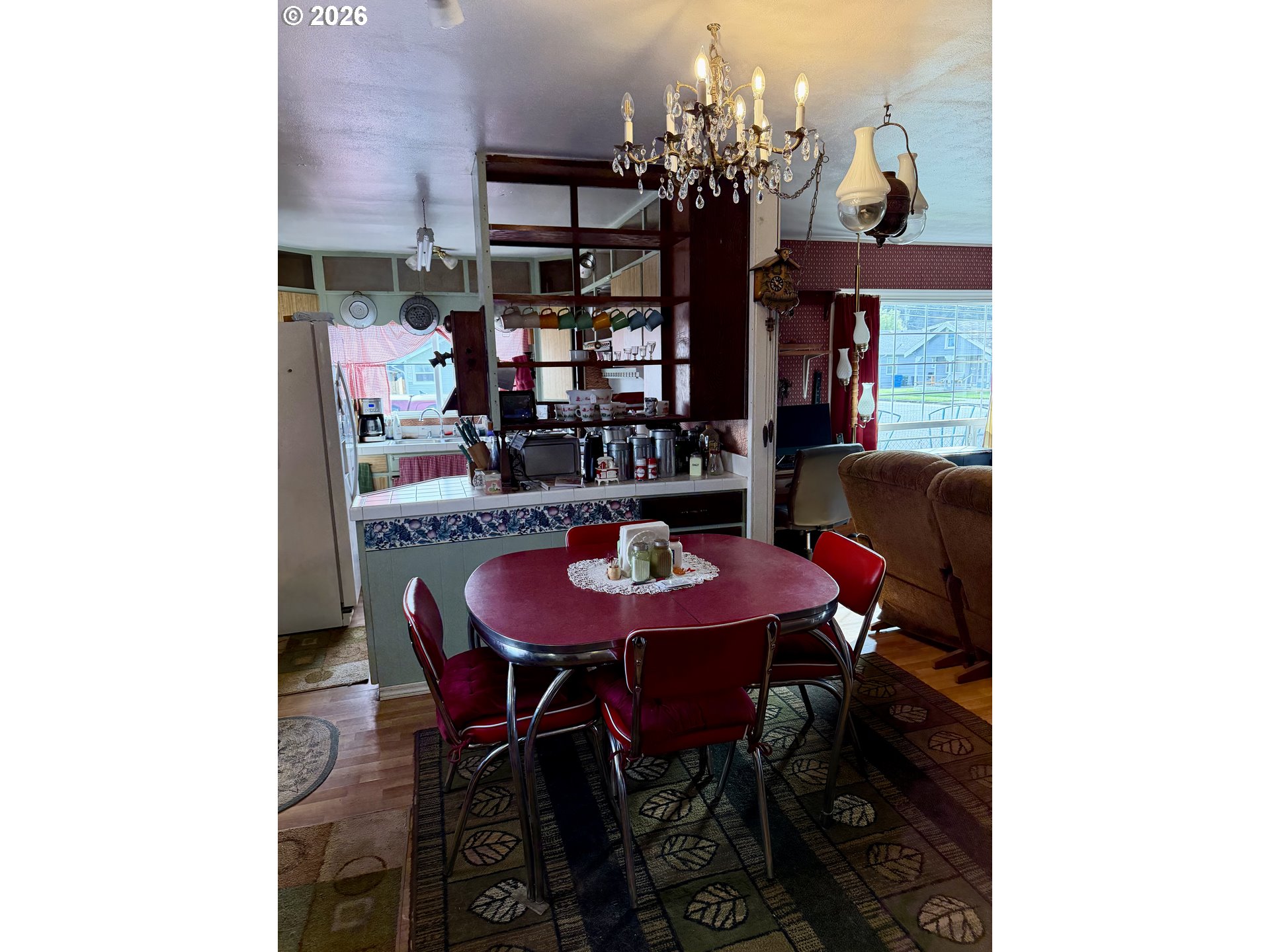 1009 Fir Avenue Reedsport, OR 97467 - Photo 3 of 16 a view of a dining room with furniture and chandelier