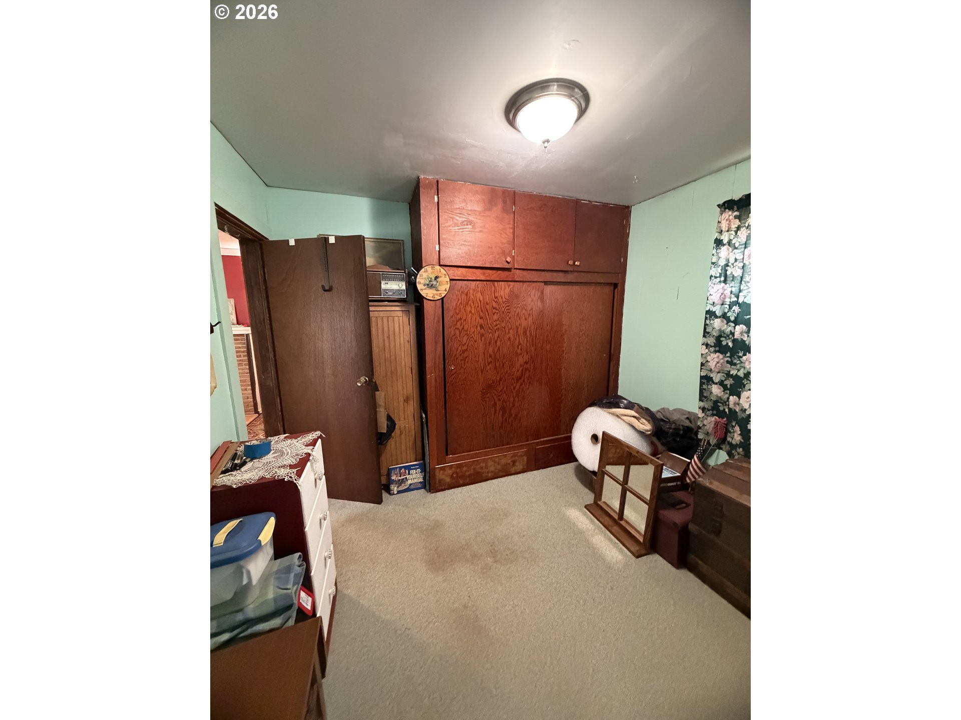 1009 Fir Avenue Reedsport, OR 97467 - Photo 10 of 16 a bedroom with a bed and a closet