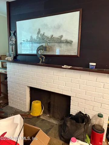 a bathroom with a fireplace and a window