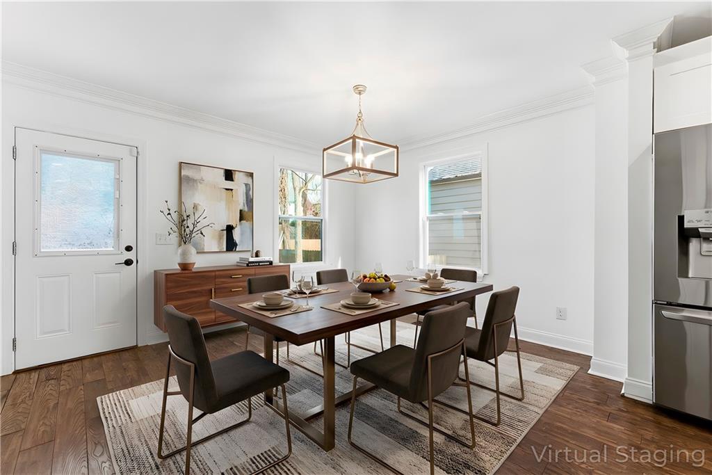 1779 North Olympian Way Southwest Atlanta, GA 30310 - Photo 14 of 48 a dining room with furniture window and wooden floor