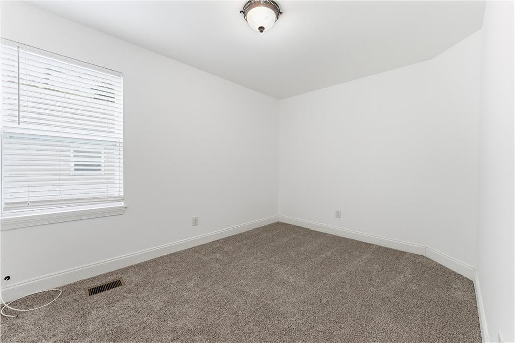 1779 North Olympian Way Southwest Atlanta, GA 30310 - Photo 21 of 48 an empty room with a window