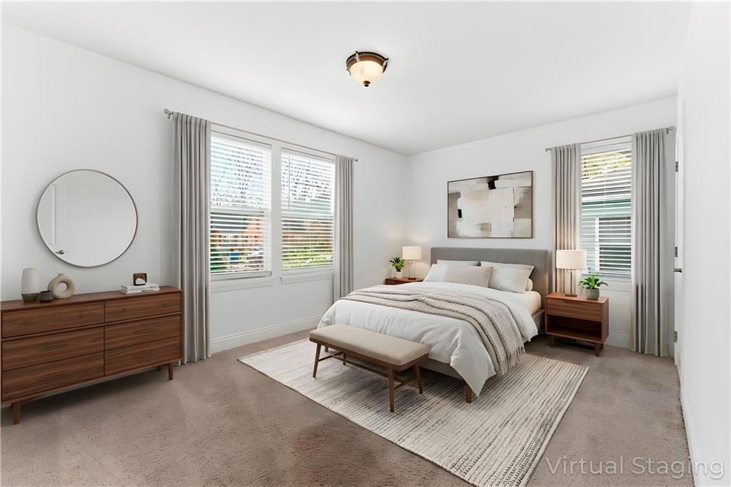 1779 North Olympian Way Southwest Atlanta, GA 30310 - Photo 22 of 48 a bed room with a bed and a mirror