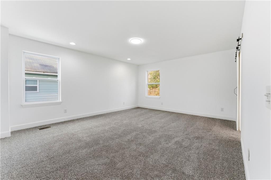 1779 North Olympian Way Southwest Atlanta, GA 30310 - Photo 24 of 48 a view of an empty room with a window