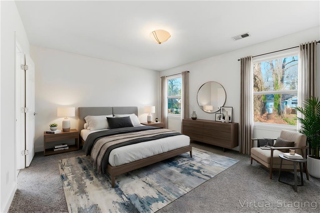 1779 North Olympian Way Southwest Atlanta, GA 30310 - Photo 29 of 48 a bedroom with a bed couch and window