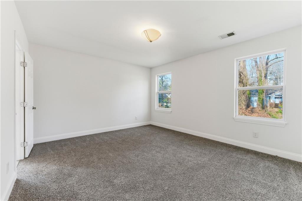 1779 North Olympian Way Southwest Atlanta, GA 30310 - Photo 30 of 48 an empty room with windows and closet
