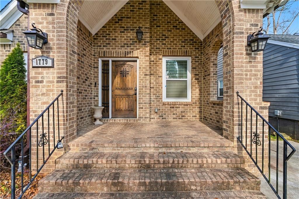 1779 North Olympian Way Southwest Atlanta, GA 30310 - Photo 4 of 48 a view of a brick house with wooden floor and windows