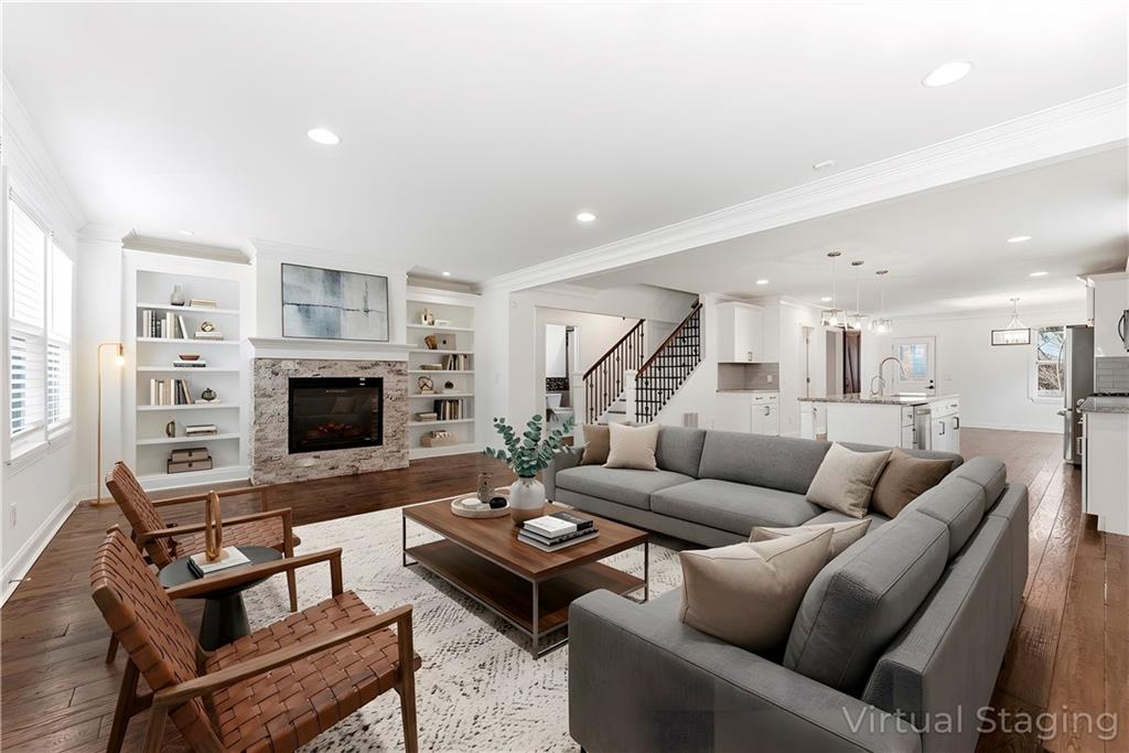 1779 North Olympian Way Southwest Atlanta, GA 30310 - Photo 5 of 48 a living room with furniture a fireplace and a flat screen tv