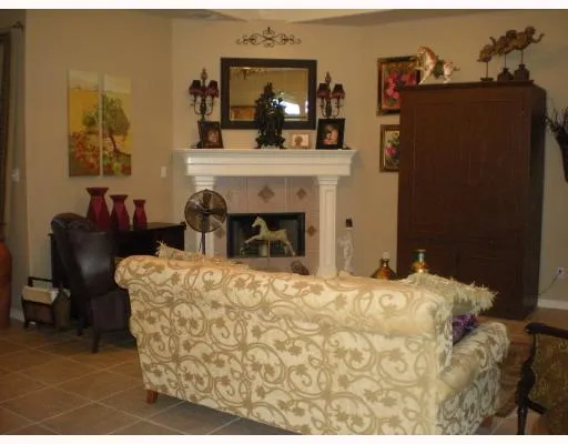 a bedroom with a bed and a fireplace