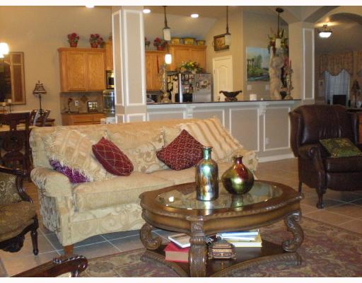 6825 Guinevere Street Corpus Christi, TX 78414 - Photo 4 of 10 a living room with furniture and a chandelier