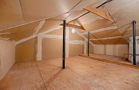 a view of a room with a glass door