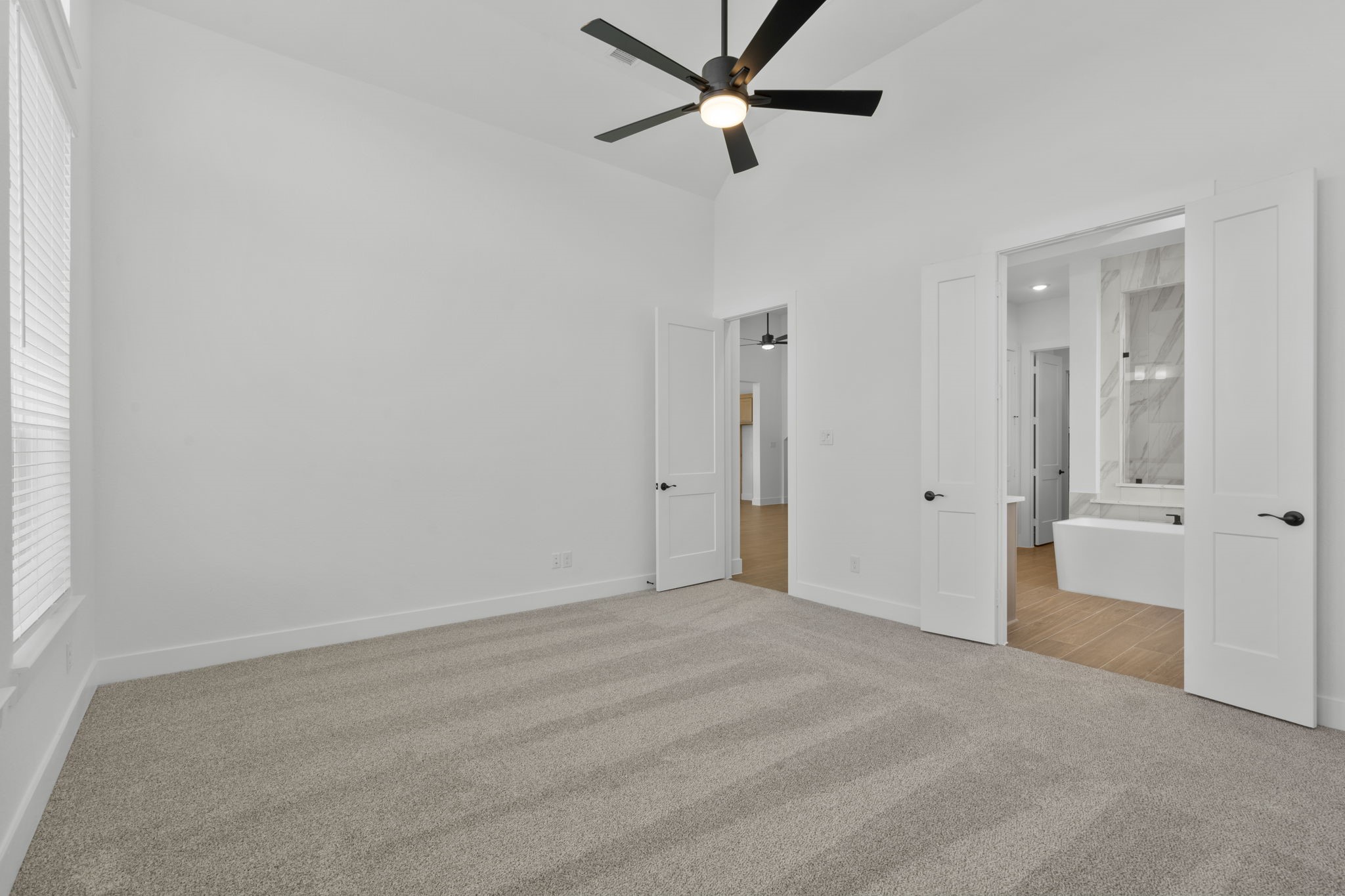 407 Blue River Trail Rosenberg, TX 77471 - Photo 16 of 45 a view of a room with a ceiling fan and hardwood floor