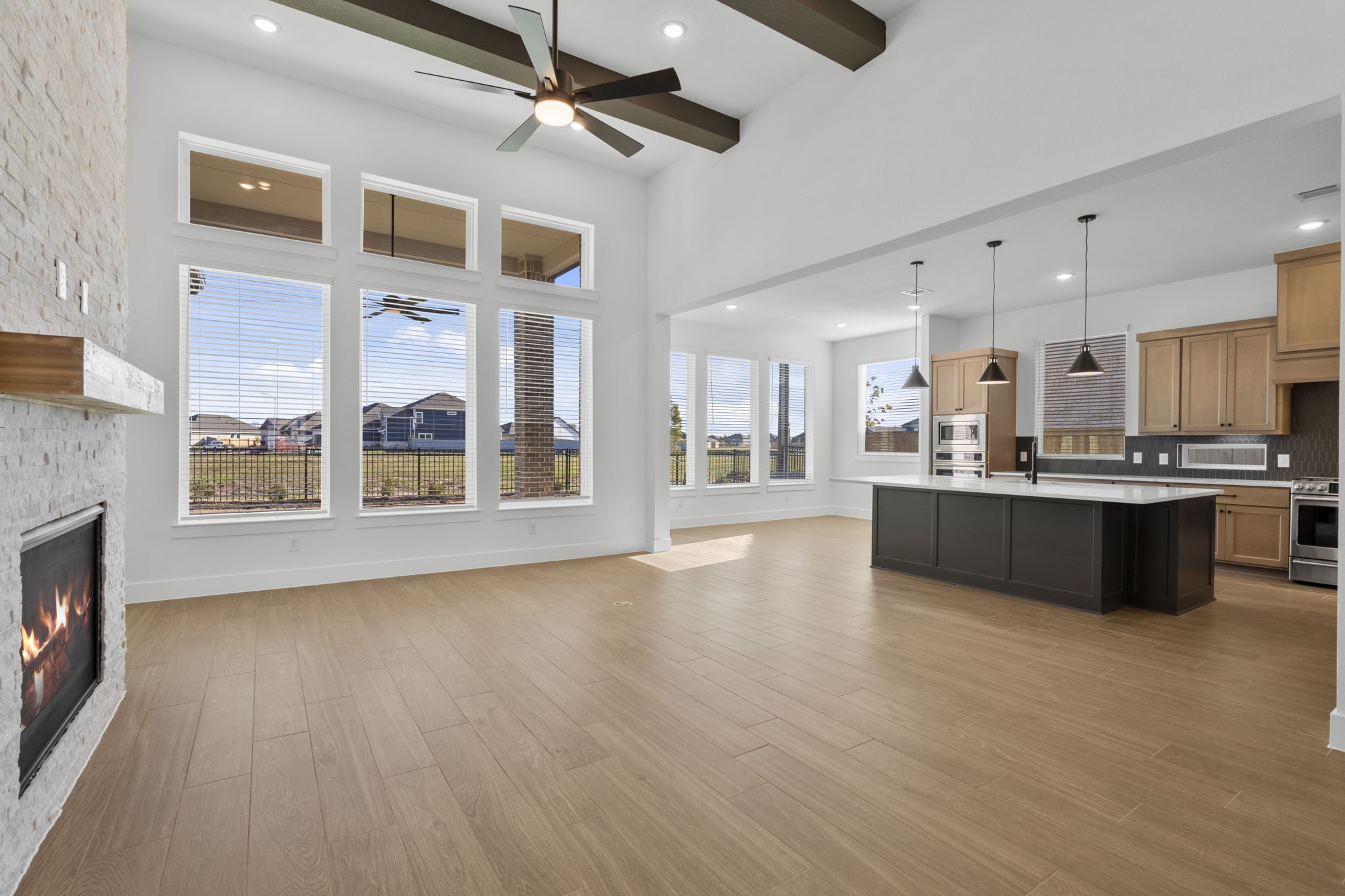 407 Blue River Trail Rosenberg, TX 77471 - Photo 21 of 45 a large kitchen with stainless steel appliances kitchen island a large counter top and a wooden floors