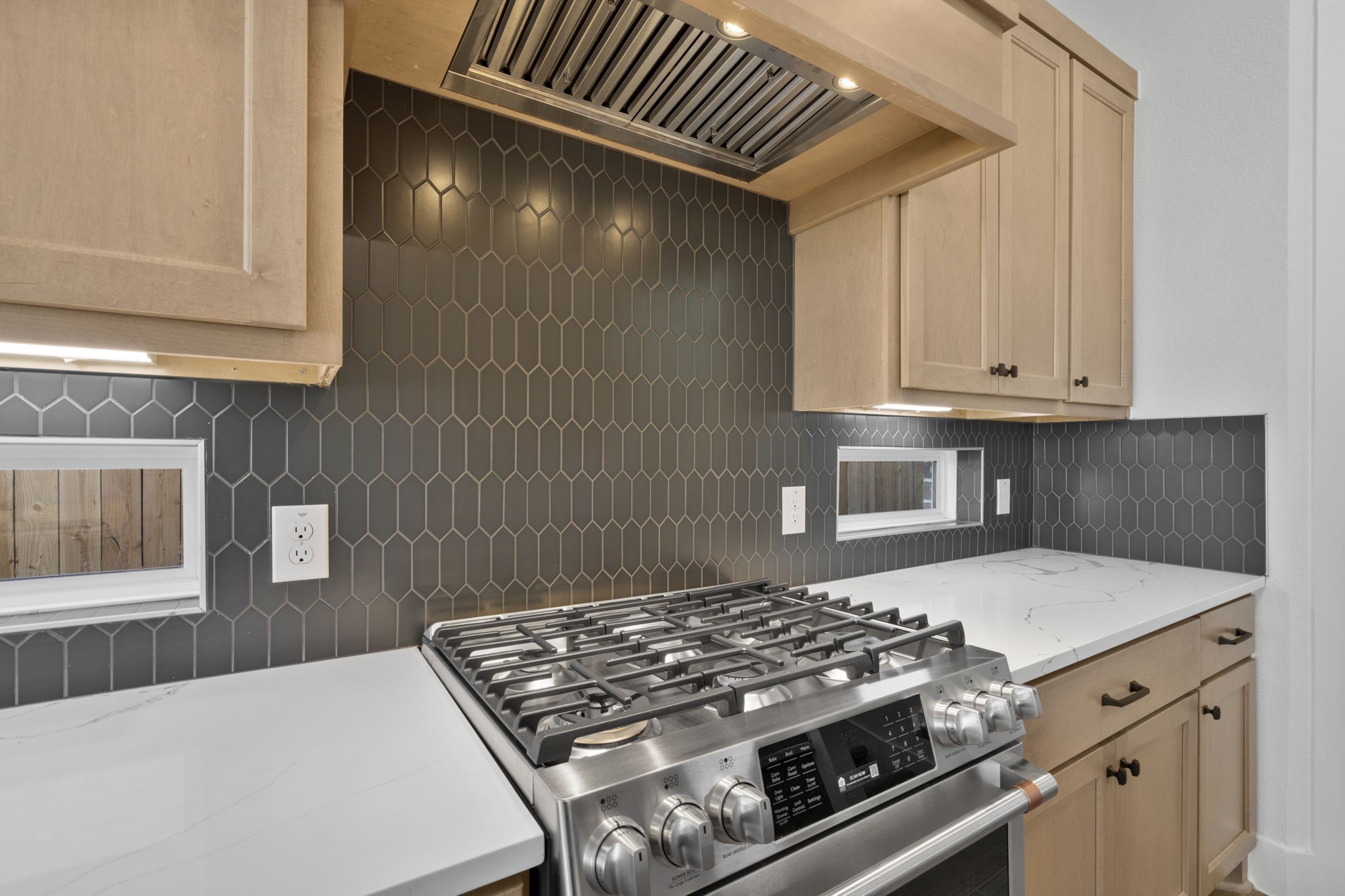 407 Blue River Trail Rosenberg, TX 77471 - Photo 28 of 45 a kitchen with stove and cabinets