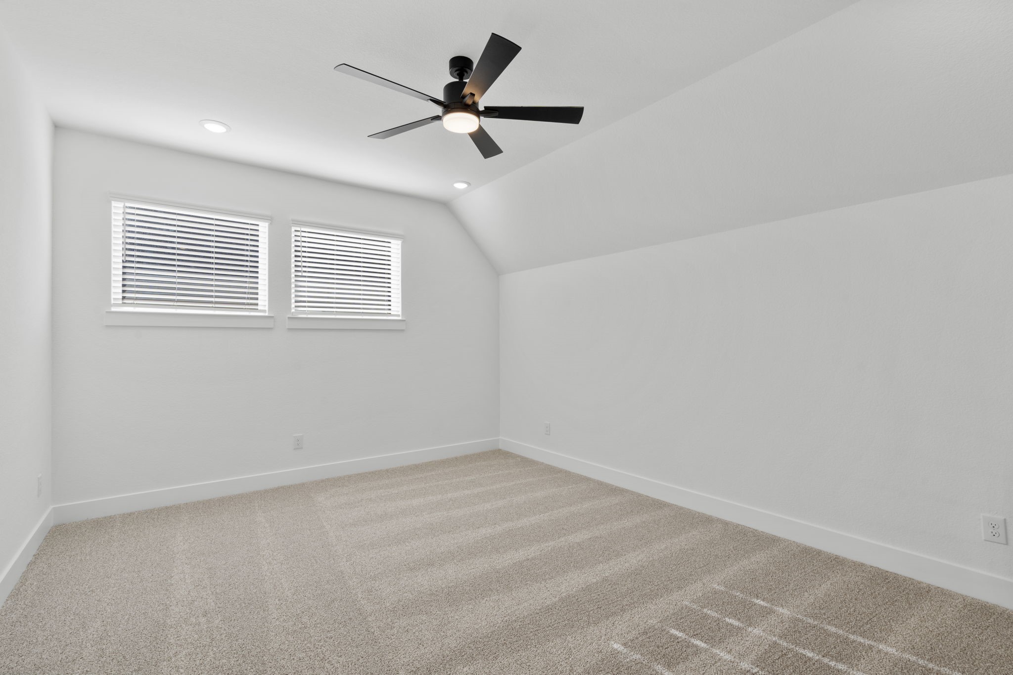 407 Blue River Trail Rosenberg, TX 77471 - Photo 30 of 45 an empty room with a window and a fan
