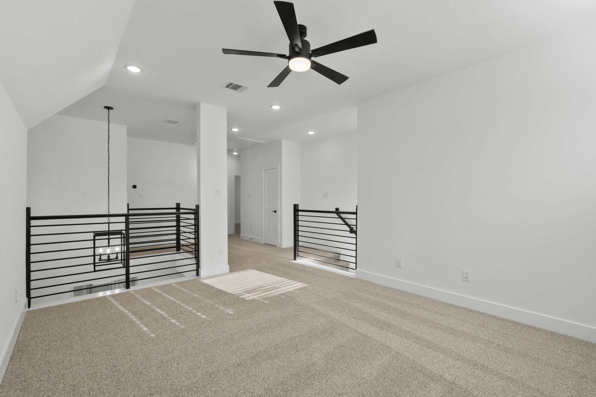407 Blue River Trail Rosenberg, TX 77471 - Photo 31 of 45 a view of a livingroom with a ceiling fan and hardwood floor