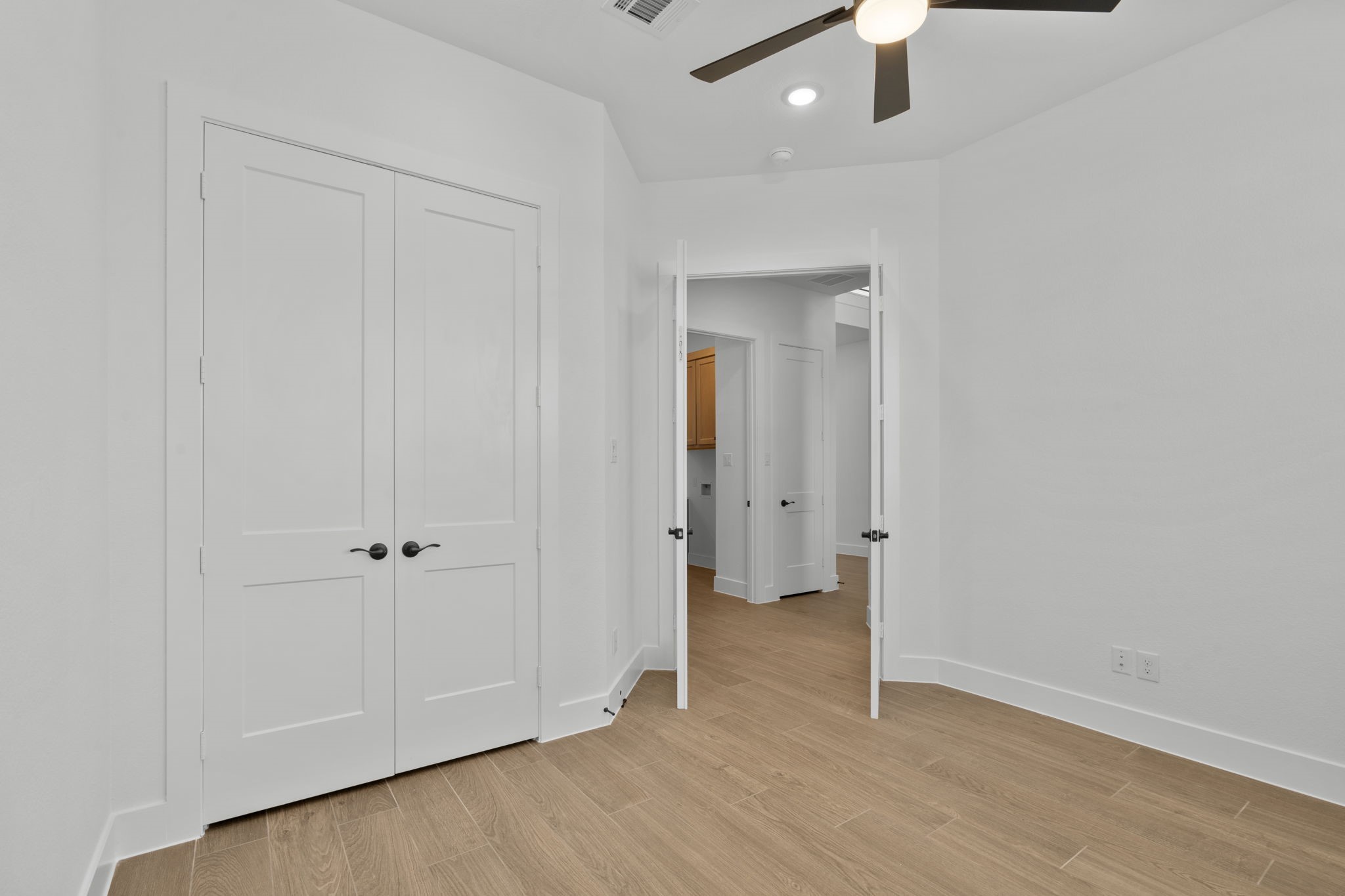 407 Blue River Trail Rosenberg, TX 77471 - Photo 5 of 45 an empty room with wooden floor
